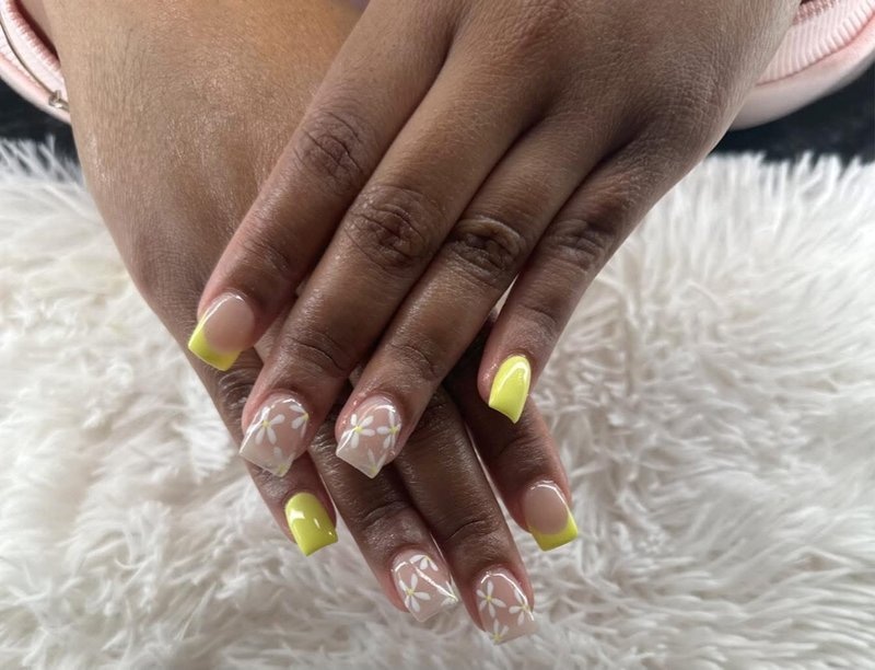 Geometric nail art with metallic accents and modern design