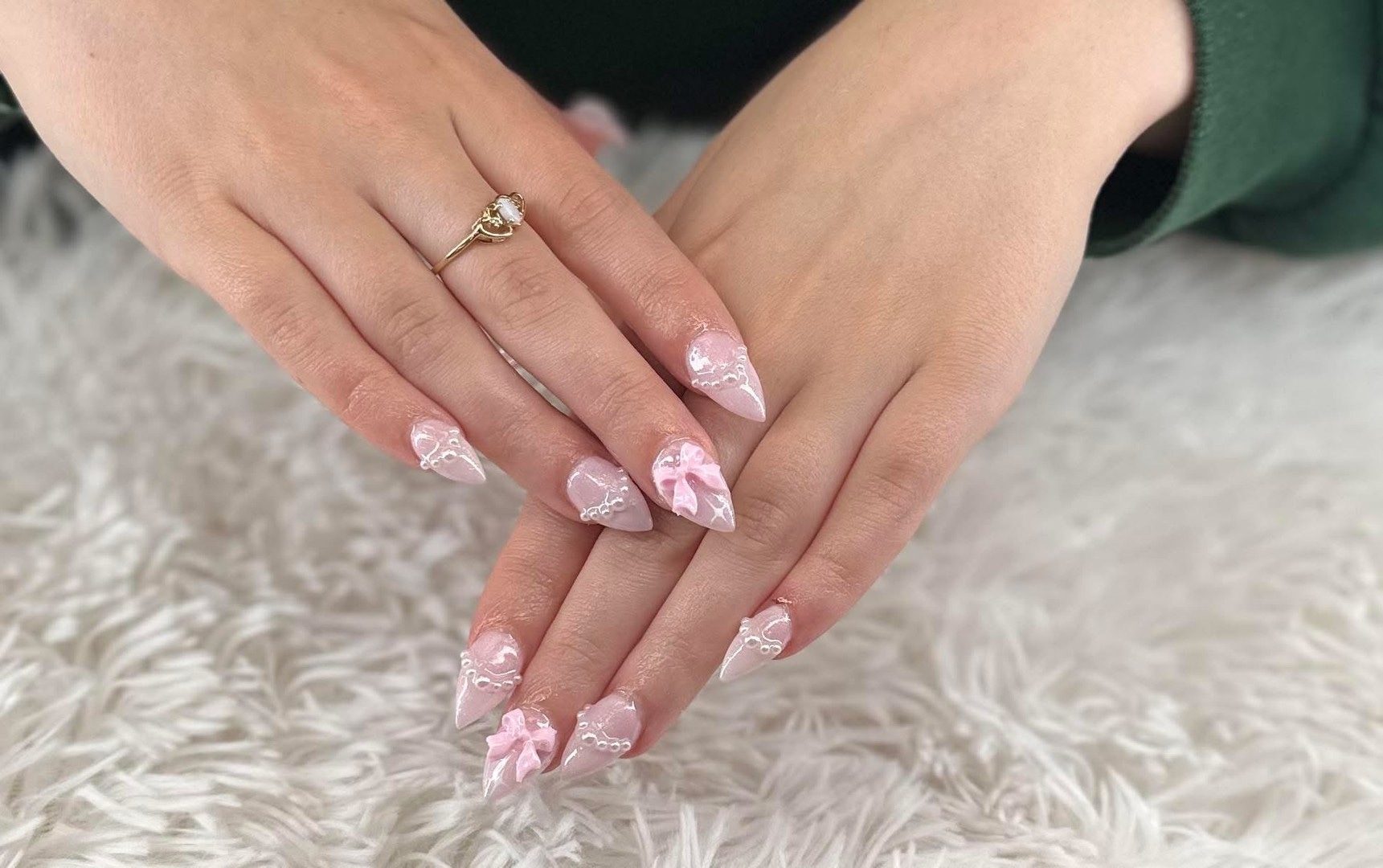 Elegant manicured hands showcasing our premium nail services